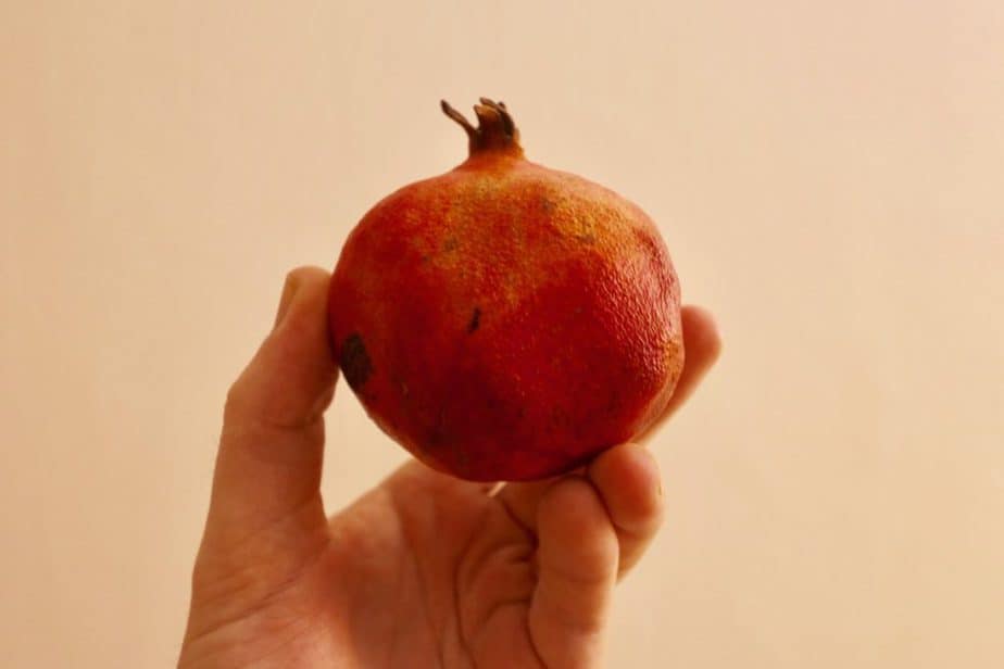 eating fruits in india pomegranate