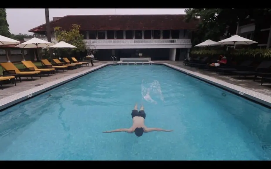 ben jenks swinging in pool in kerala first class hotel
