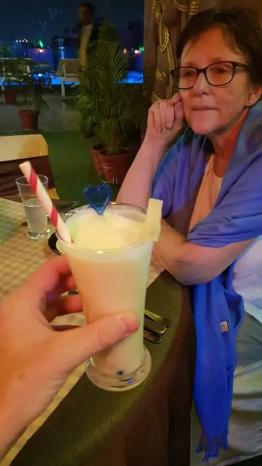 alcohol in india me holding a pina colada cocktail with mom