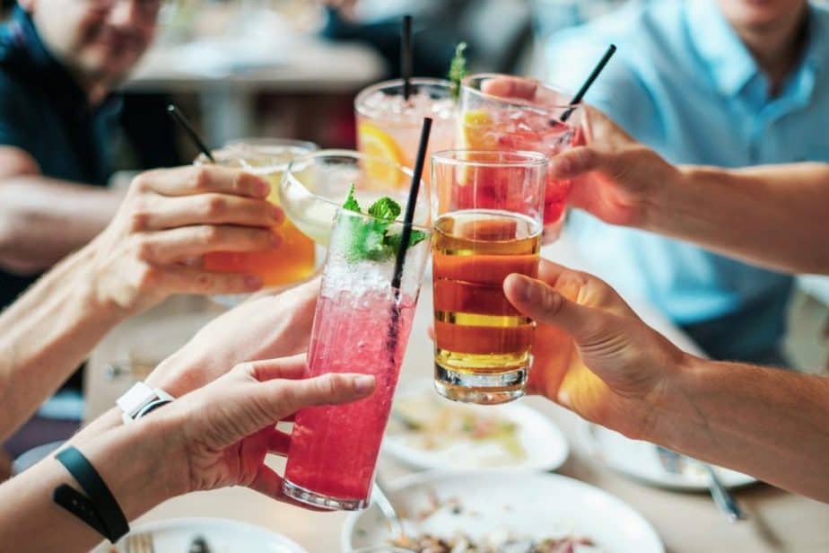 alcohol in india group of people cheers cocktails social happy