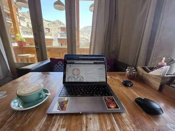 workation-delhi-leh-ladakh-tibetan-palace-computer-coffee