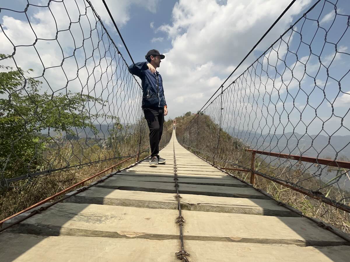 Lalsvunga Park hanging bridge in Aizawl with mountains in the distance taken by Ben Jenks